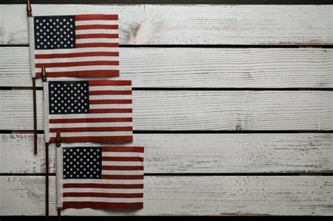 Premium Photo American Flags On Wooden Surface On Independence Day Photo