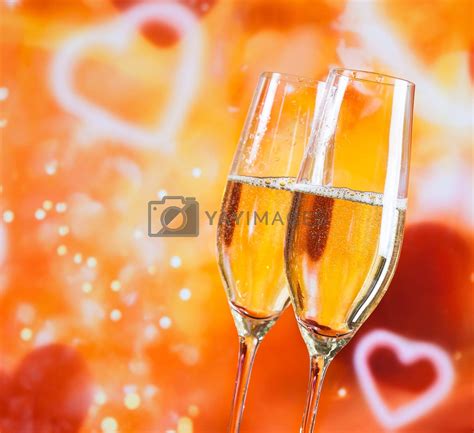 Champagne Flutes With Golden Bubbles On Blur Decorative Hearts Background By Donfiore Vectors