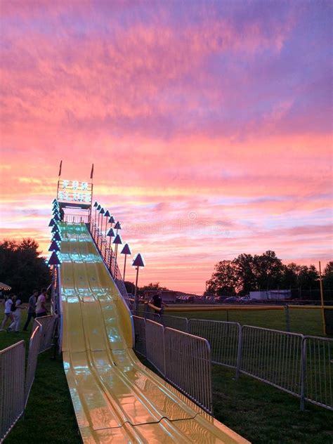 Giant Fun Slide At Fairgrounds At Sunset Stock Photo Image Of