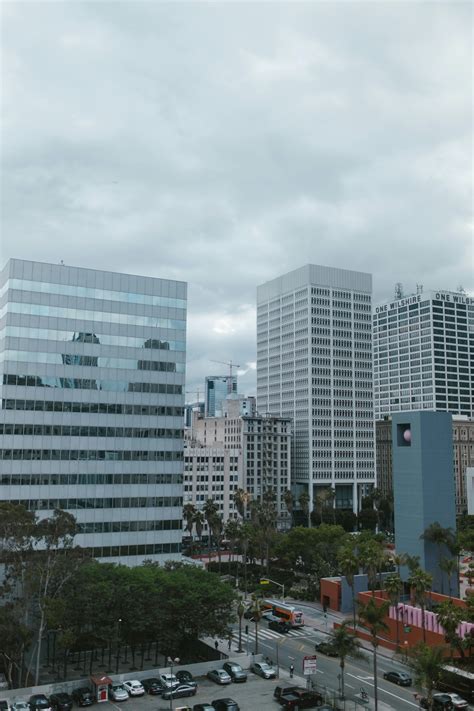 City High Under Cloudy Sky during Daytime · Free Stock Photo