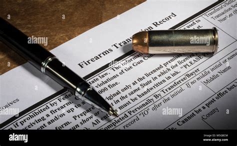 Nics Background Check Form For A Gun Purchase With A Cartridge And Pen