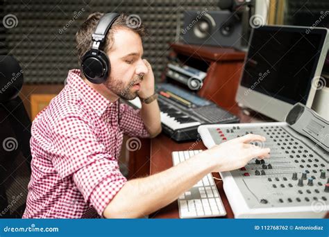 Sound Engineer Working On Mixing Console Stock Photo Image Of Latin