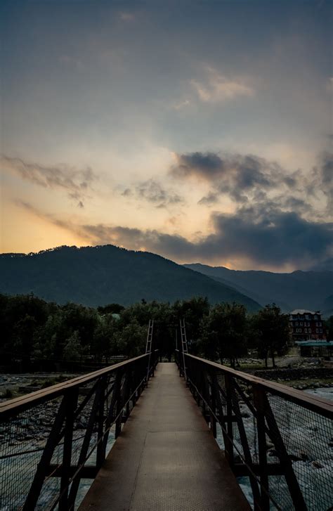 Brown Wooden Bridge Over The Mountain During Daytime Photo Free