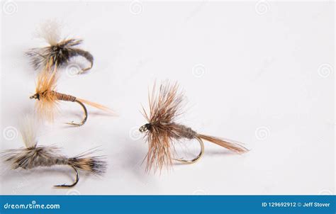 Closeup Of Artificial Fishing Flies Or Lures On A Simple Background