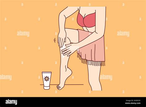 Woman In Bikini Apply Sunscreen On Legs On Beach Female In Swimsuit Using Oil Or Balm Sun