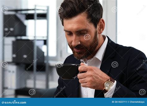 Handsome Bearded Man Drinking Cup Of Coffee Indoors Stock Image Image