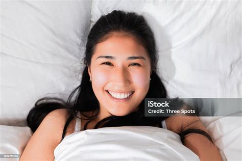 Photo Portrait Of Delighted Smiled With White Teeth Kazachstan Japanese Chinese Girl In Bed