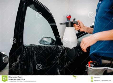 Male Hand with Spray, Car Window Tint Installation Stock Image - Image ...