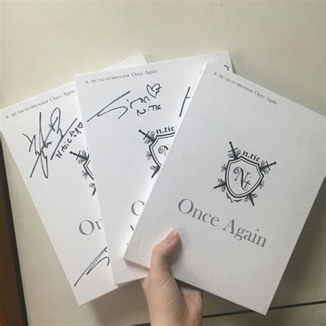 Someone Is Holding Three Copies Of Once Again Cards In Their Hand With