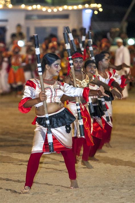 Stick Performers Move Through The Arena During The Kataragama Festival