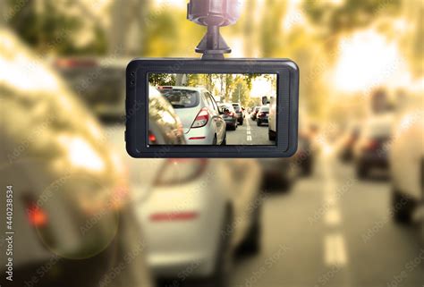 Modern dashboard camera mounted in car, view of road during driving Stock Photo | Adobe Stock