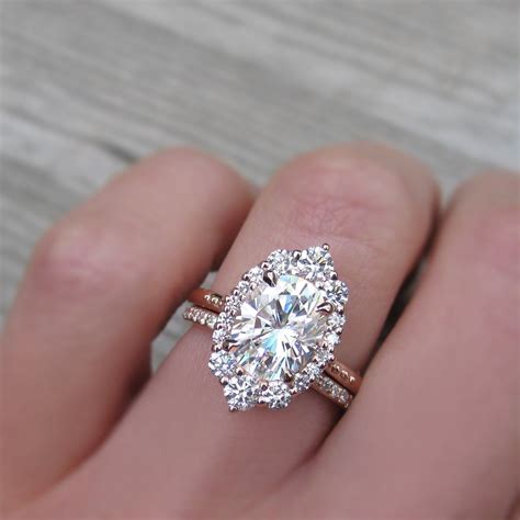 25 Carat Oval Halo Engagement Ring Paired With A Conflict Free Pavé