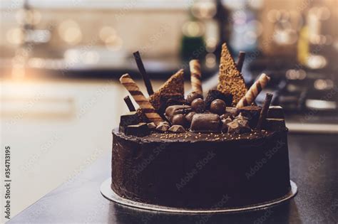 Home Made Chocolate Brownie With Blurry Kitchen Background Chocolate Fudge Cake With Yellow