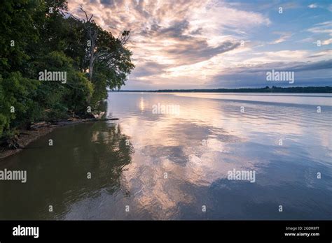 A Peaceful Potomac River Reflects A Striking Sunset In Late Summer From