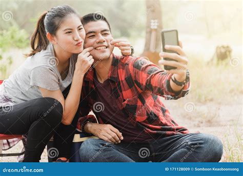 Couples Using Smartphones To Take Selfies Stock Image Image Of