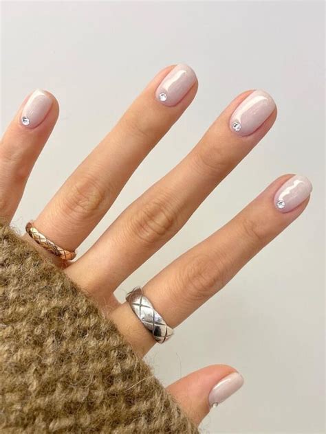 Milky White Short Nails With A Rhinestone Accent Plaid Nail Designs