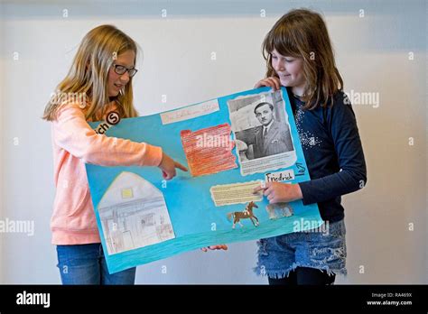 Two students with poster giving a presentation, primary school, Lower ...