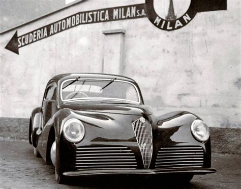 An Old Car Parked In Front Of A Building With A Sign That Reads Severia