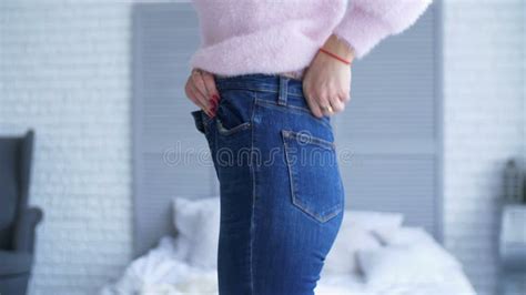 Adult Woman Trying To Zip Up Tight Jeans At Home Stock Footage Video