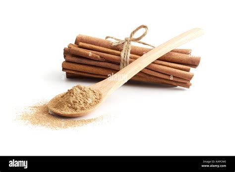 Cinnamon Sticks And Cinnamon Powder Isolated Over White Background