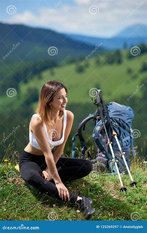 Sporty Woman Hiker With Backpack Resting In The Mountains Stock Image