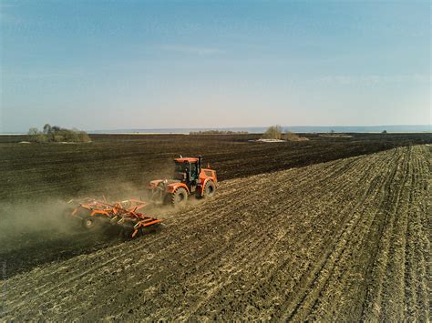 "Aerial View Of A Modern Tractor Plowing Dry Field, Preparing Land For ...