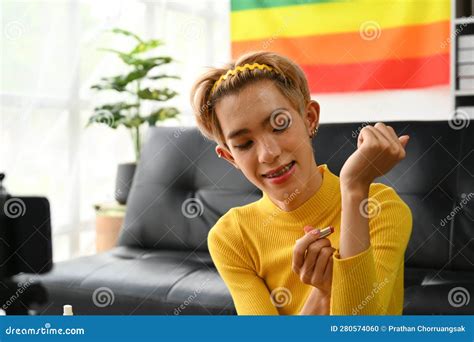 Smiling Asian Gay Man Blogger Filming Daily Makeup Routine Tutorial On