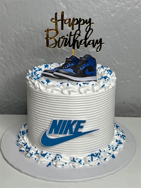 A Birthday Cake With A Nike Shoe On Top