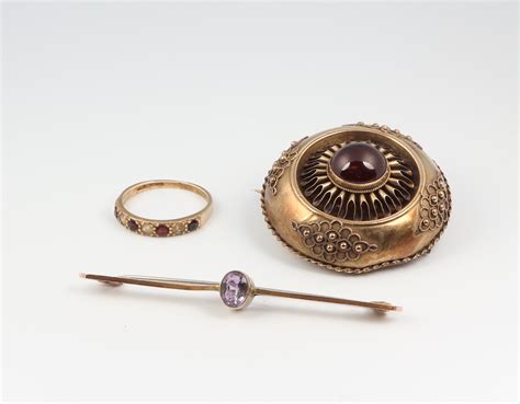 A Victorian Gilt Etruscan Style Garnet Set Brooch A Th December