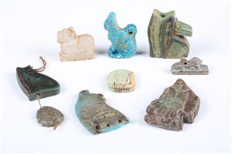 A group of eight Egyptian faience amulets, including two Udjat-eye ...