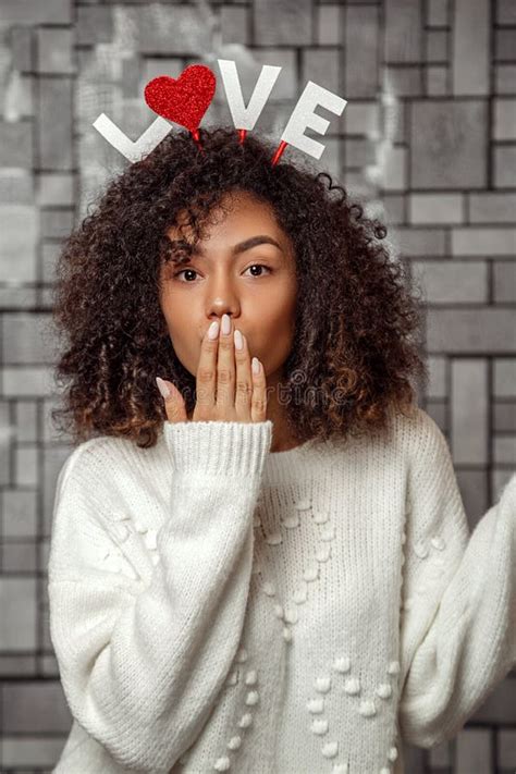 Close Up Portrait Of A Young Curly Haired African American Girl In A