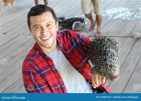 Indigenous Man Holding a Brazilian Porcupine Stock Photo - Image of person, exotic: 167059744