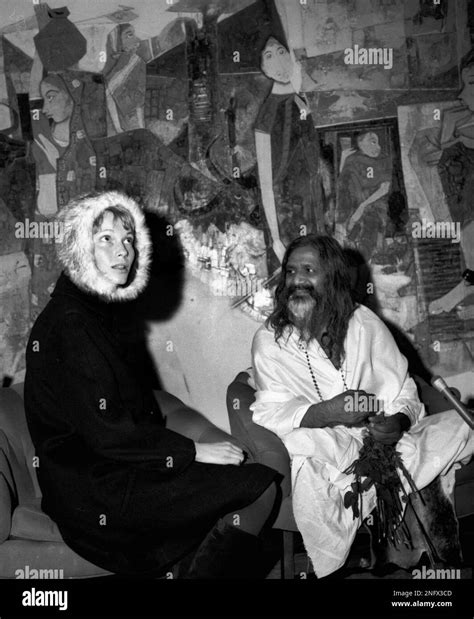 Maharishi Mahesh Yogi, one of India's spiritual teachers, sits with ...