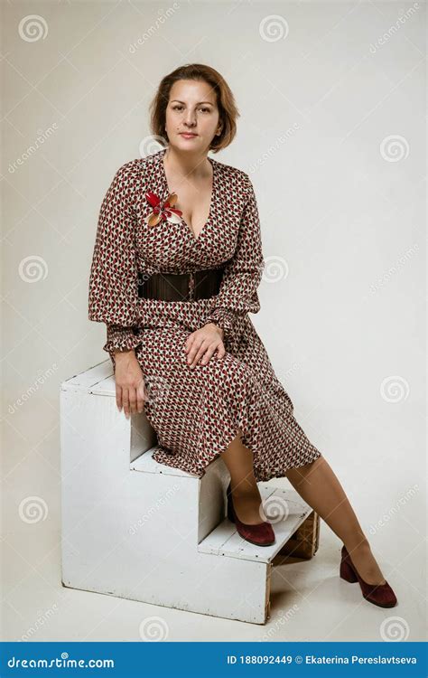 Mature Woman Posing In The Studio In The Background Stock Image Image Of Female Dress