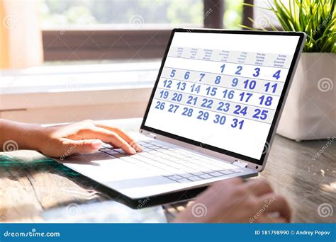 Businesswoman Looking At Calendar On Laptop Stock Photo Image Of Hand