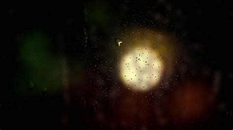 Premium Stock Video Raindrop On Windows Blur Night Background With A