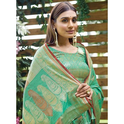 Turquoise Woven Raw Silk Saree With Tassels