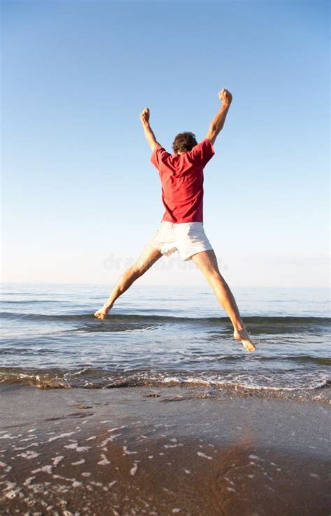 Man Jumping On The Beach Stock Image Image Of Summer