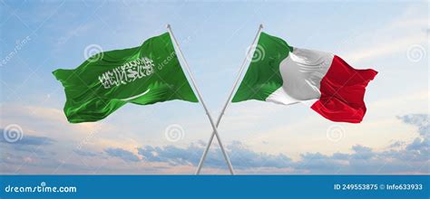 Two Crossed Flags Saudi Arabia And Italy Waving In Wind At Cloudy Sky