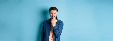 Free Photo Ignorant And Rude Guy Showing Middle Finger And Smiling Say Fuck You Standing On