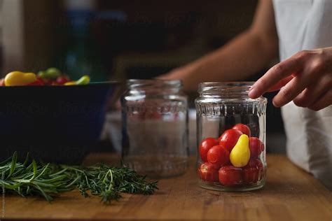 Woman Canning Cherry Tomatoes By Stocksy Contributor Ibex Media