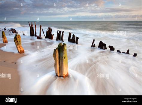 Derelict Sea Defenses At Happisburgh On The Norfolk Coast Stock Photo