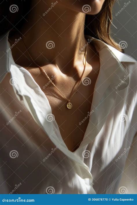 A Woman Wearing A Gold Necklace And White Shirt Stock Photo Image Of