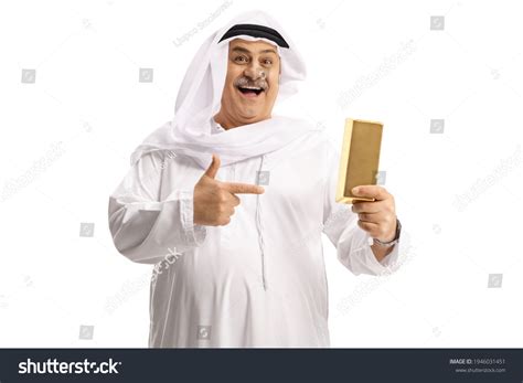 Happy Mature Arab Man Holding Gold Stock Photo 1946031451 Shutterstock