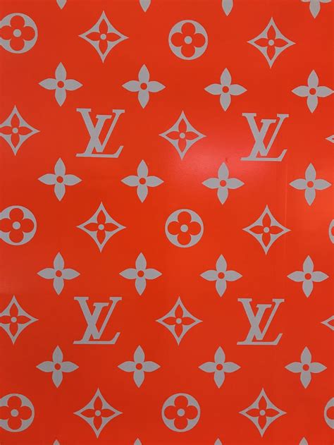 An Orange Background With White Louis Vuitton Symbols