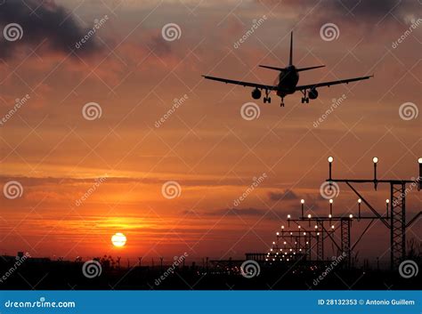 Plane landing in a sunset stock image. Image of commercial - 28132353