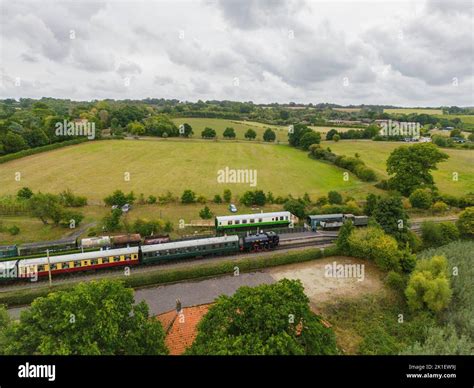 An Aerial Shot Of A Steam Engine Pulling Wagons In Bodiam Station Kent And East Sussex Railway