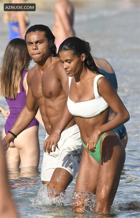 Tina Kunakey Hits The Beach Dressed In Her Skimpy Green Bikini In