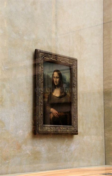 Masterpiece Mona Lisa Hanging Behind Glass Wall Seen In One Of Many