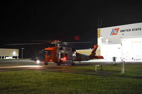 A Coast Guard Mh Jayhawk Helicopter Crew From Aviation Nara